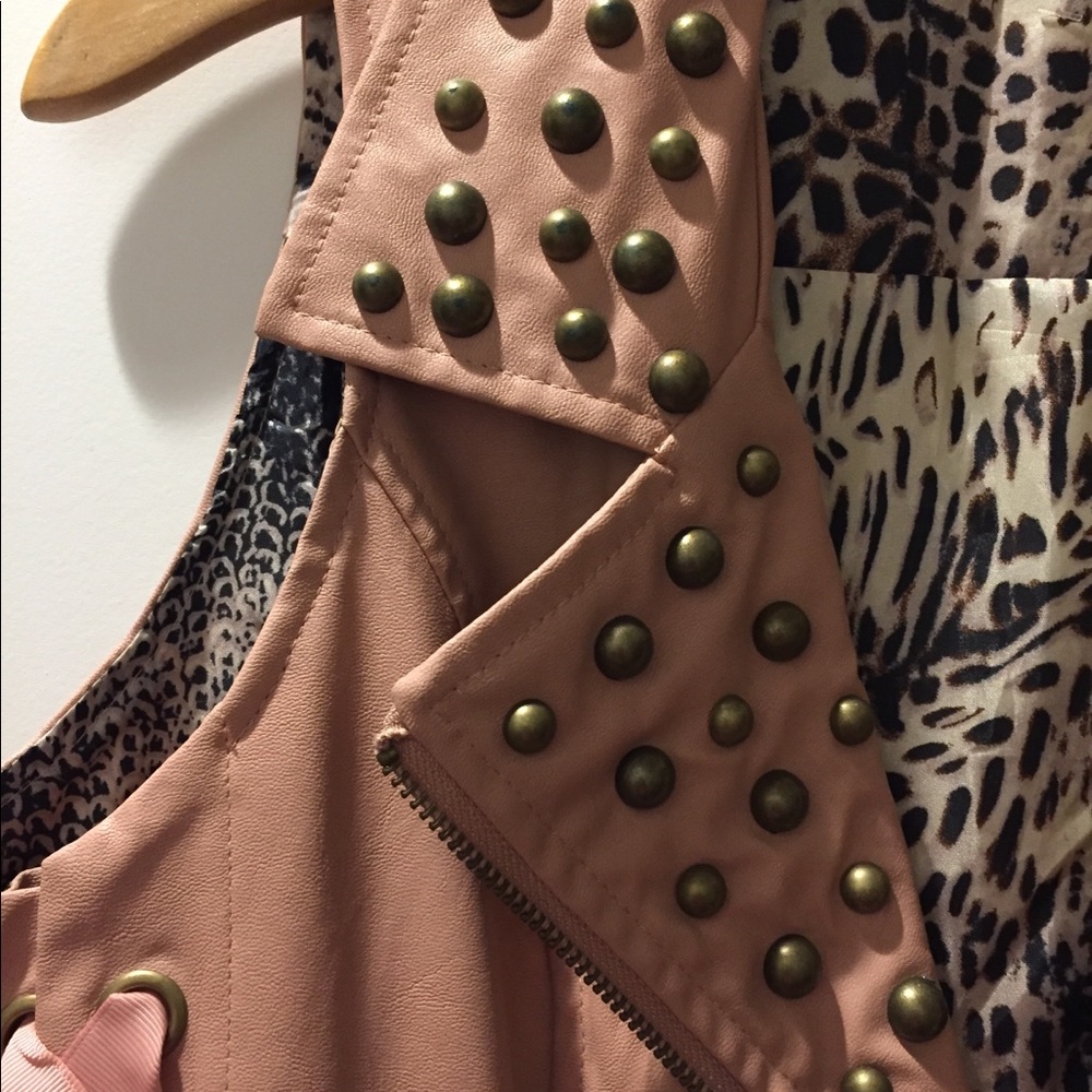 Vest with bronze studs